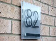 Cayman double acrylic house number sign with the iconic contrasting fixing plate by Plastic Republic. Size 200 x 200mm £41.99