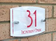 Modern Marletti double acrylic house number sign with chrome stand off fixings shape T4 by Plastic Republic.Size 210 x 148. Price £24.98 